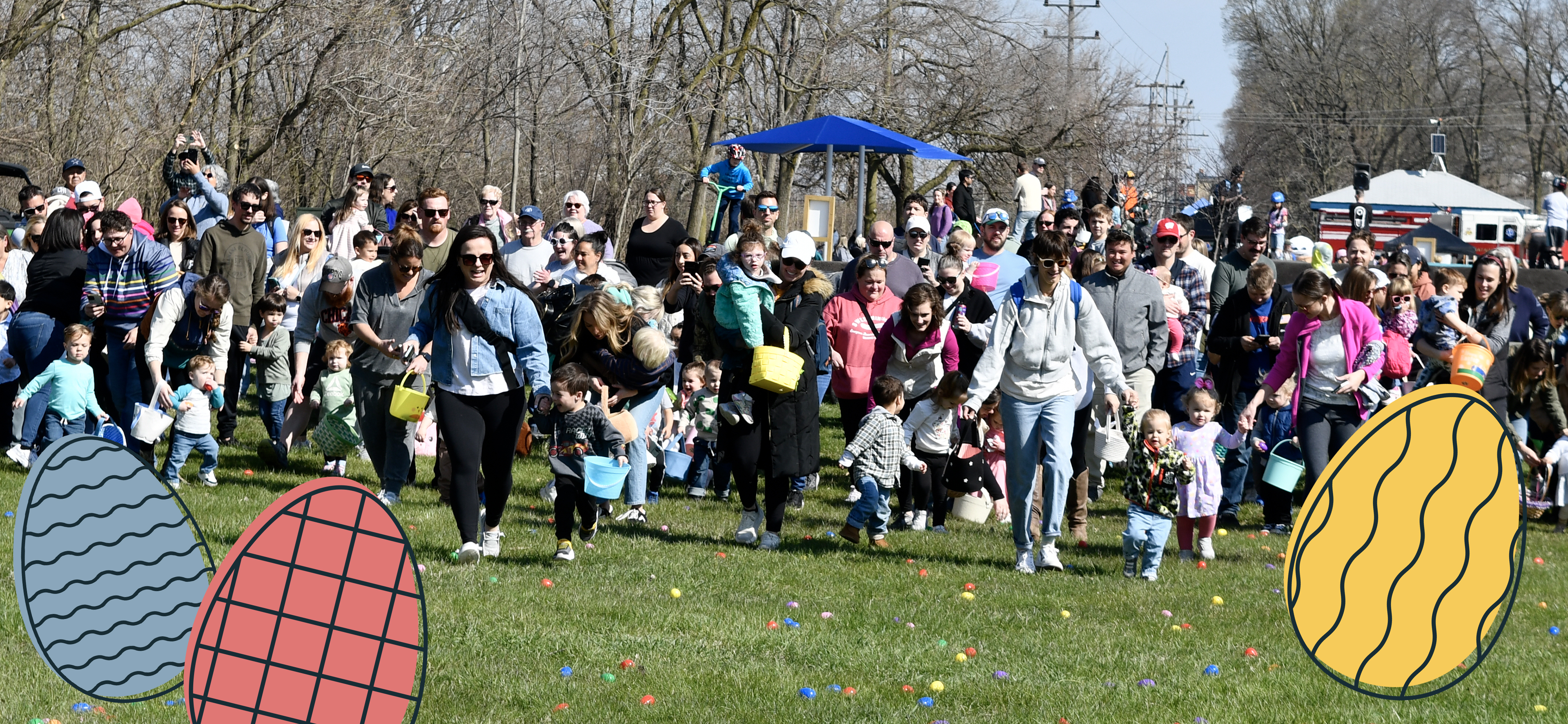 Families rush to gather eggs during the community egg hunt event
