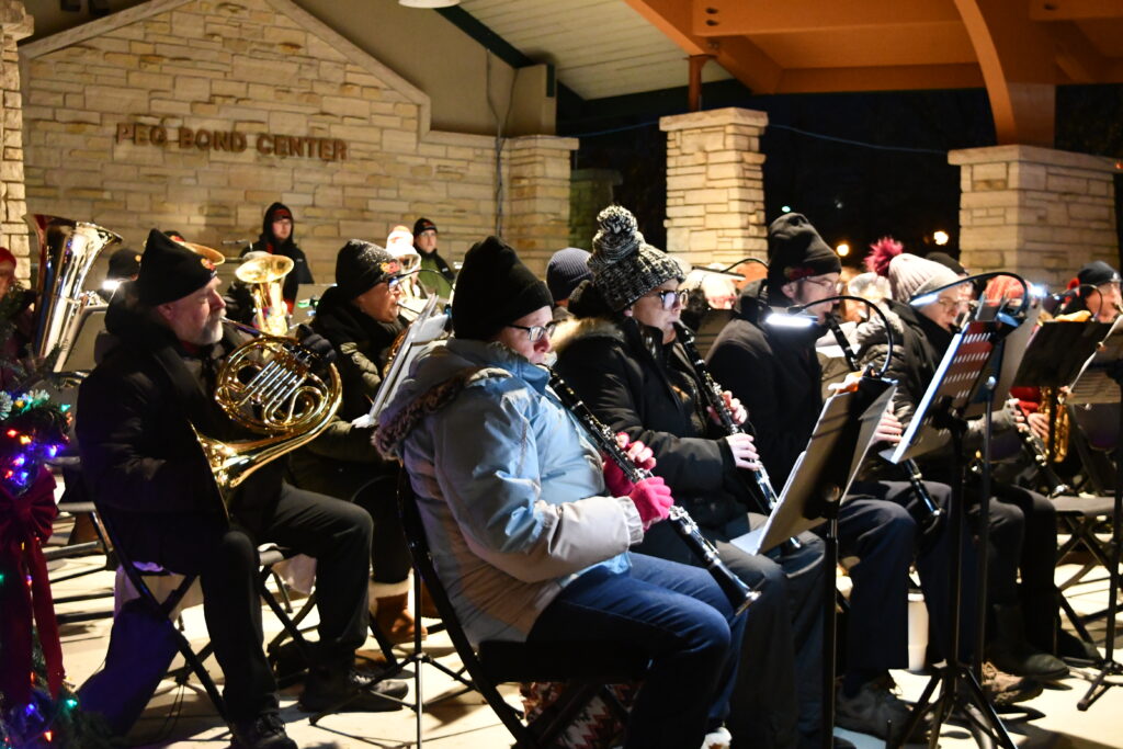 Community band members play outdoors
