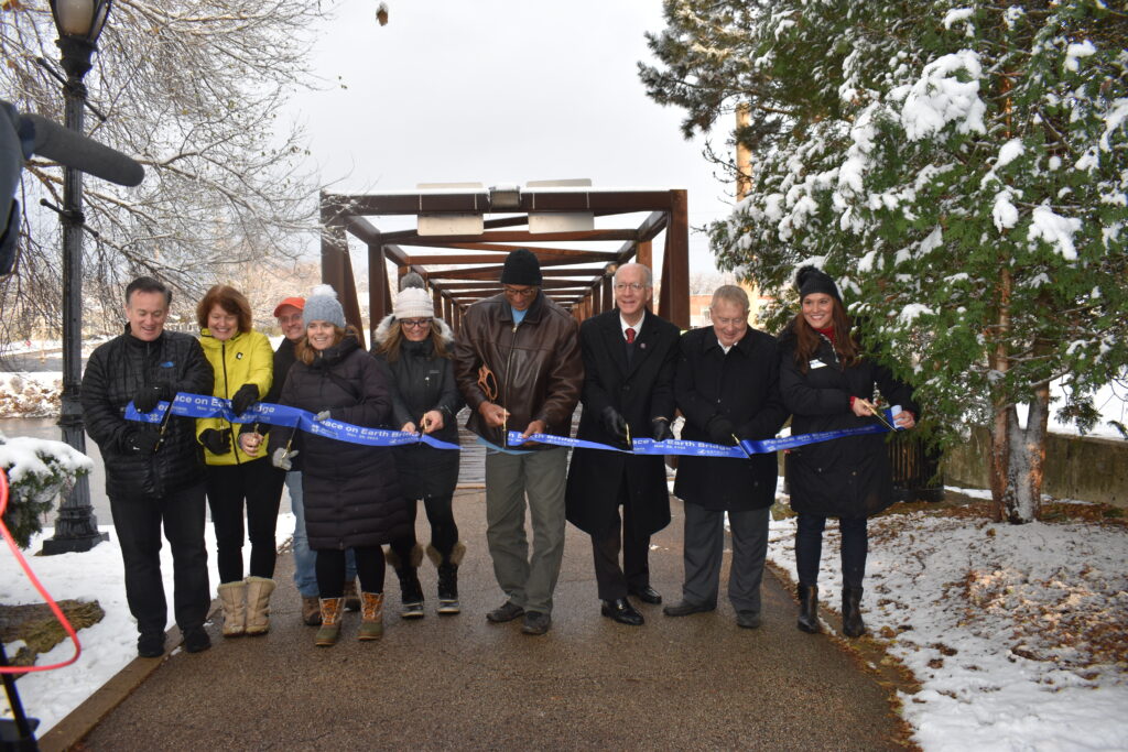 Batavia Park District Board Members cutting grand opening ribbon for Peace Bridge.