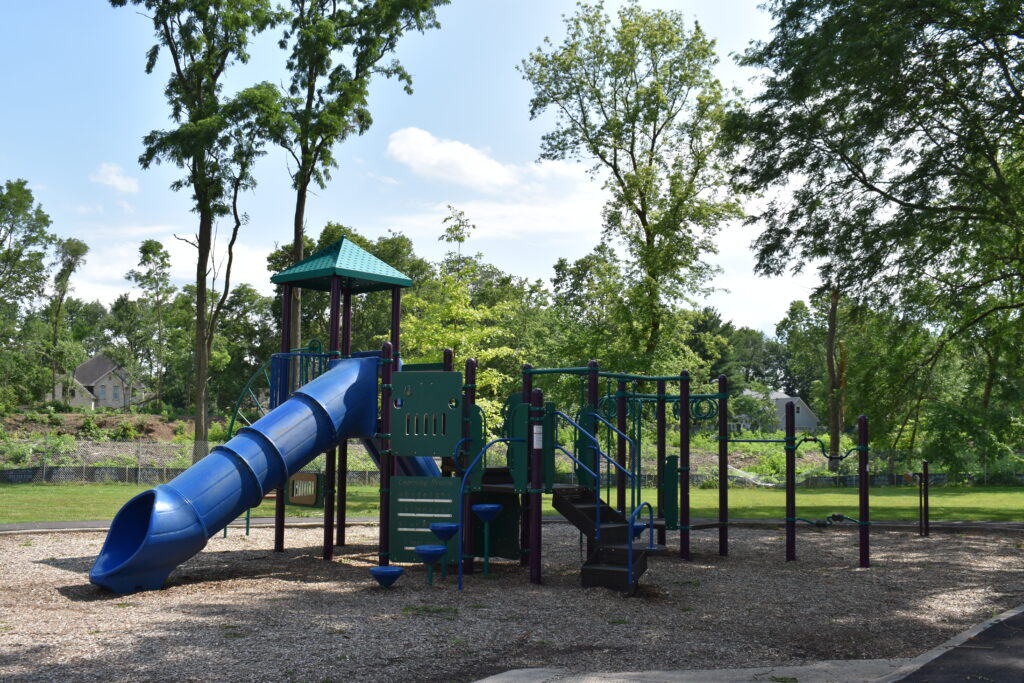 Carriage Crest Park geared towards older children. The park has a slide and climbing structures.