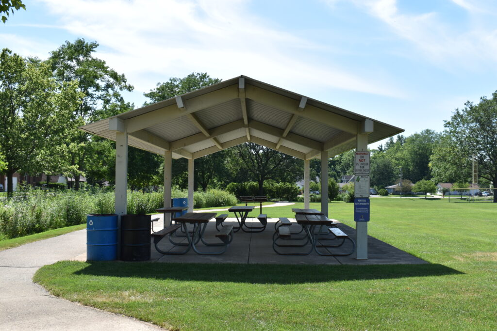 Prairie and Lathem Park rentable shelter with picnic tables, recycling bin, trash can and community grills.