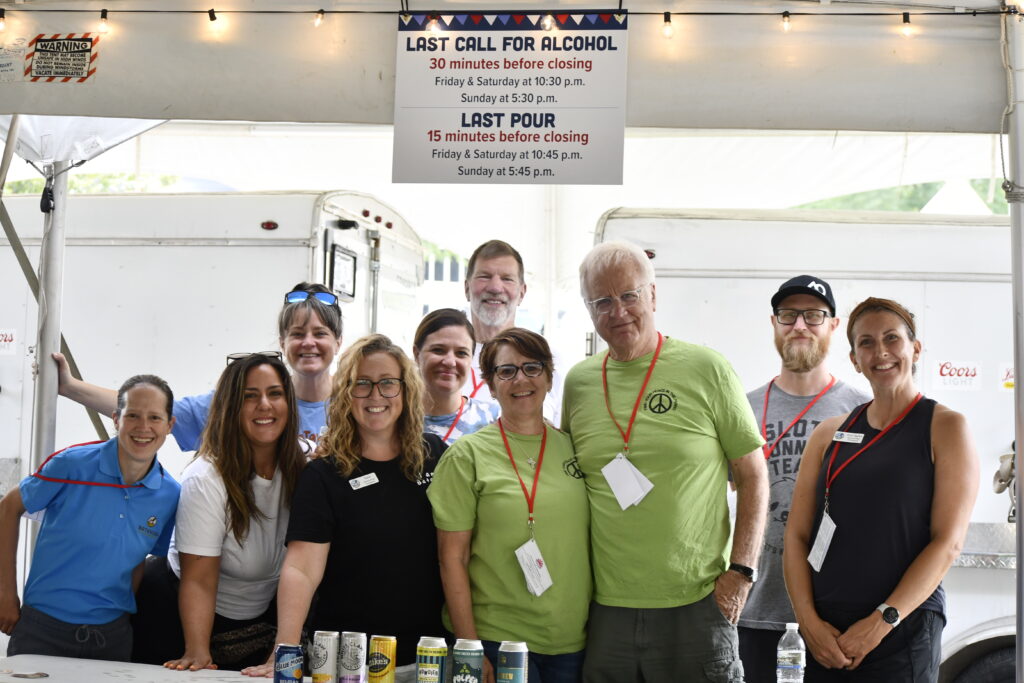 Batavia Parks Foundation members serve beer during windmill city festival