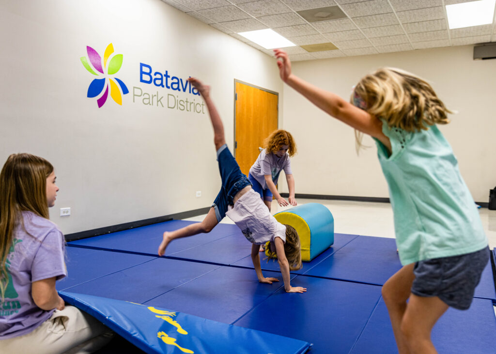 tumbling students practice cartwheels