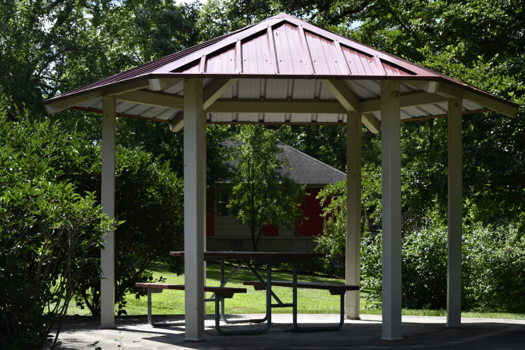 Philip B. Elfstrom Memorial Greenway small shelter showing a picnic table.