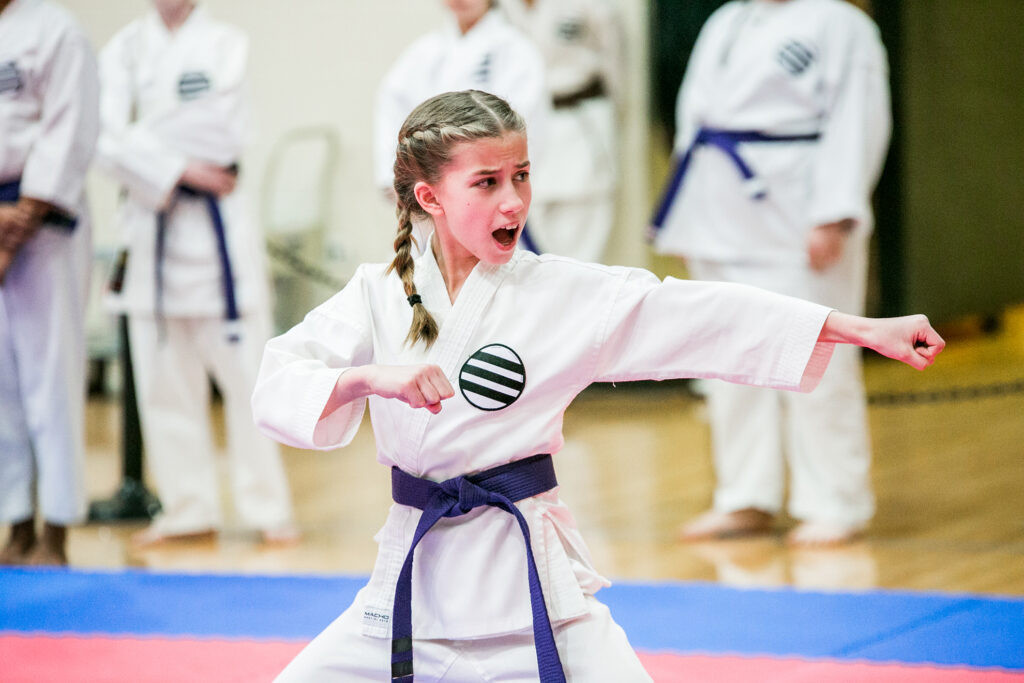 A karate student demonstrates control and form in class
