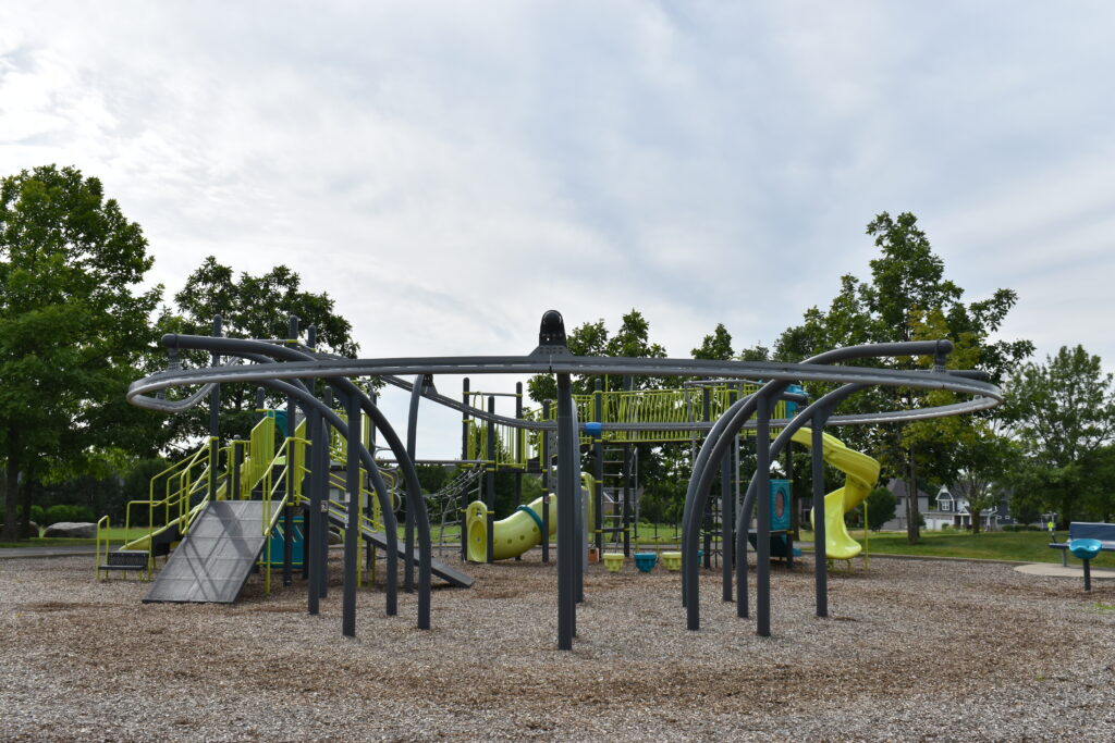 Prairie Path Park playground featuring a zipline.