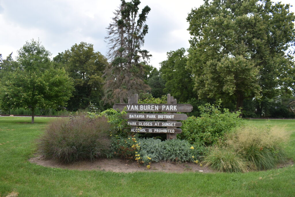 Van Buren Park sign that says park name and hours.