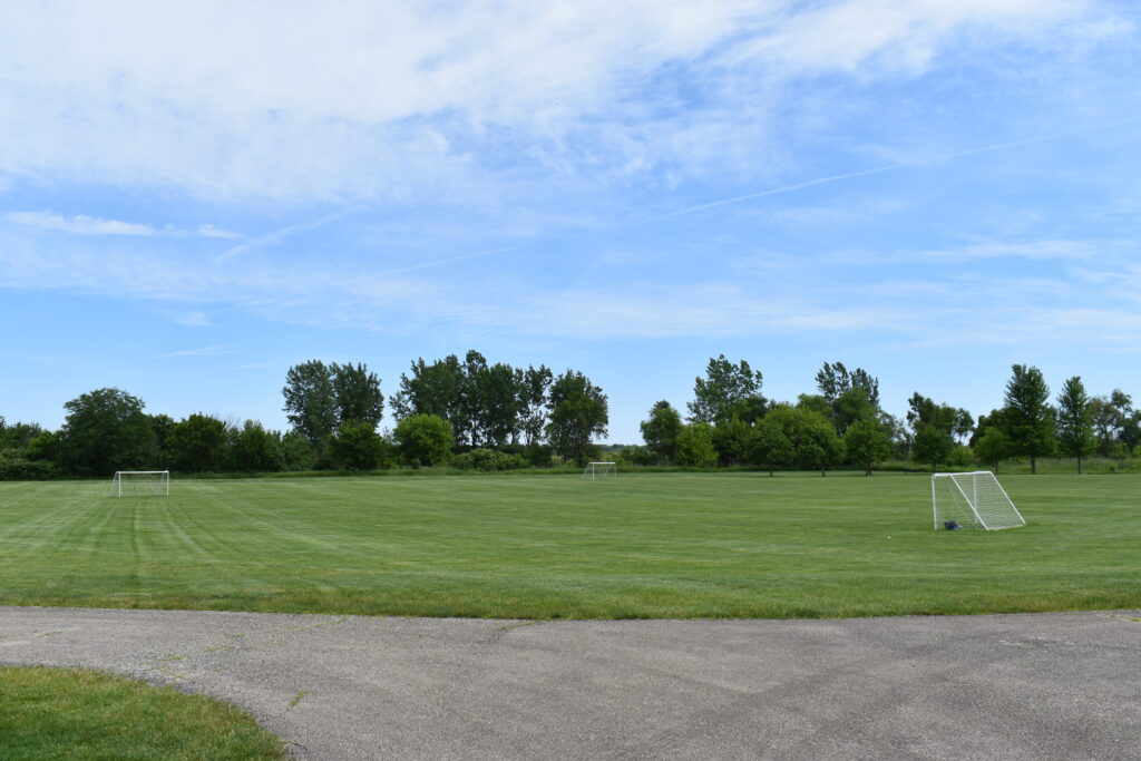 West Main Community Park open grassy soccer field.