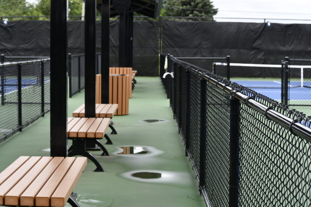 West Main Community Park benches by the pickleball court.