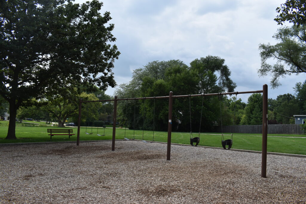 Woodland Hills Park swings that include swings for infants and older children.