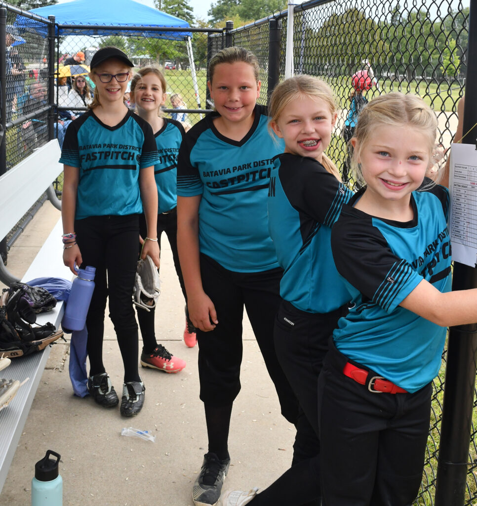 5 girls on the Batavia Park District Softball team pose for a picture in the dugout