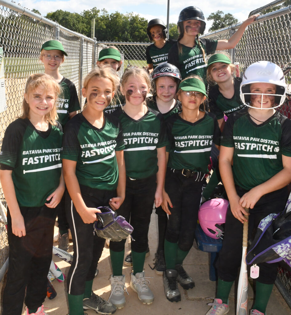 Batavia Girls softball team, ages 10-11, poses for a photo after a game