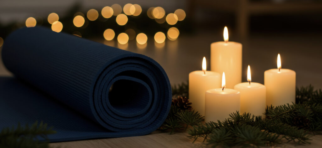 A yoga mat sits by some candles.
