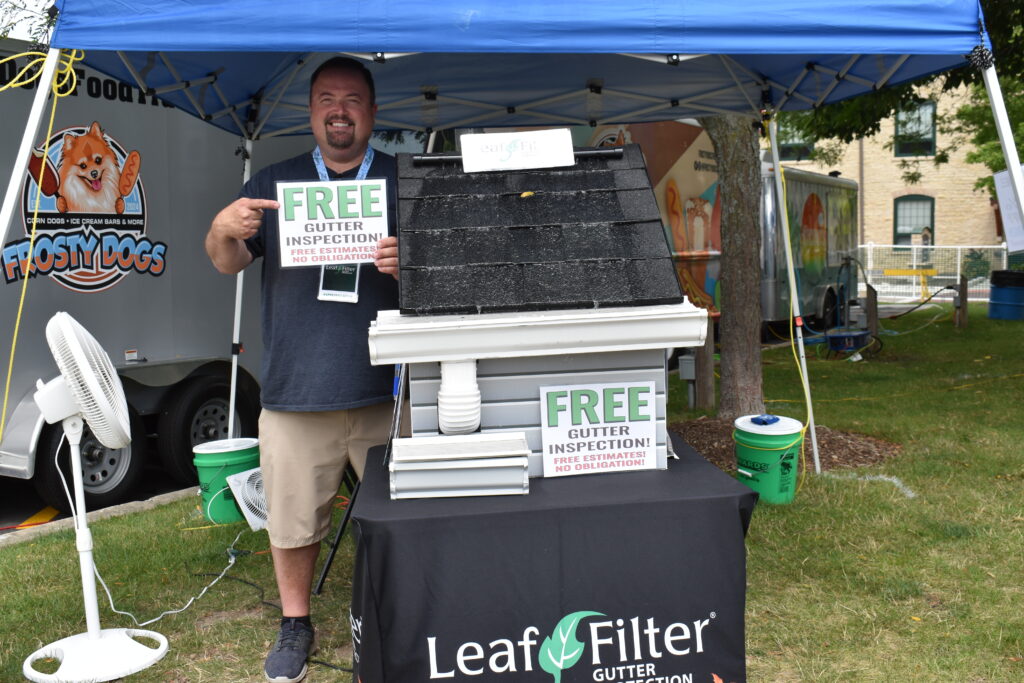 Leaf Filter man near a table