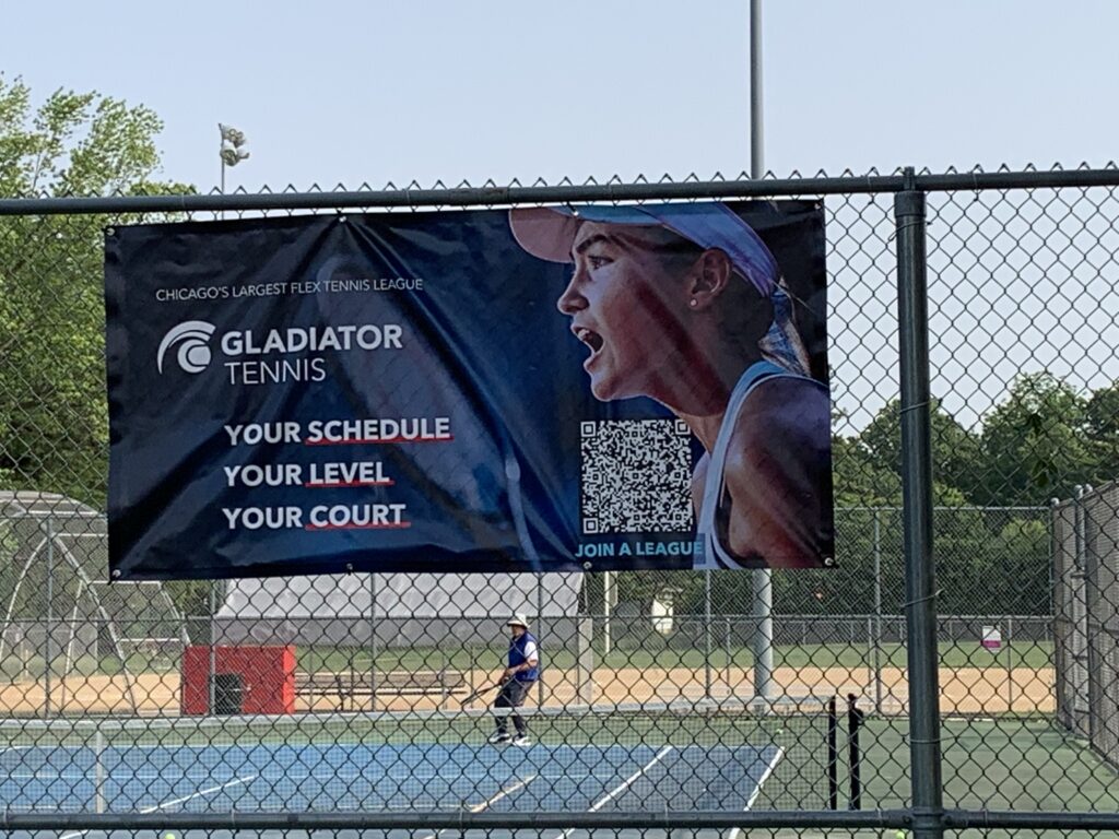Banner hanging on chain link fence