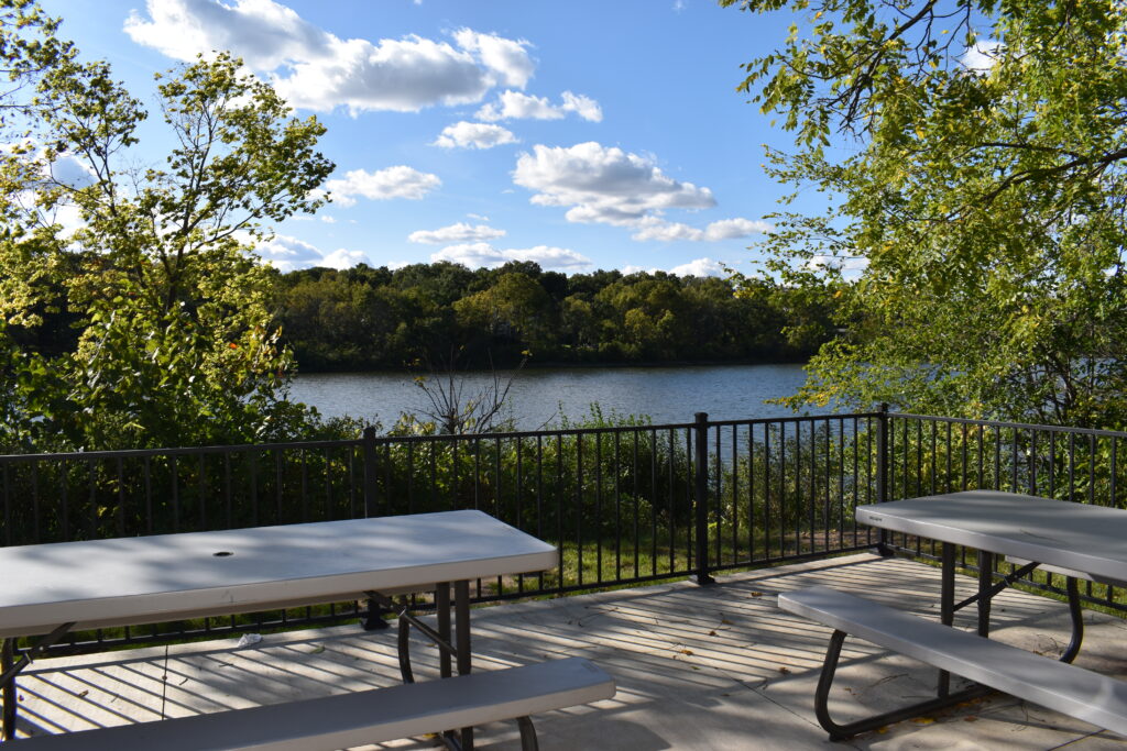 Patio deck overlooking the river in summer.