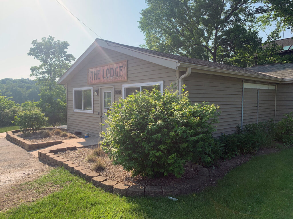 Side view of a rustic building along the river in summer