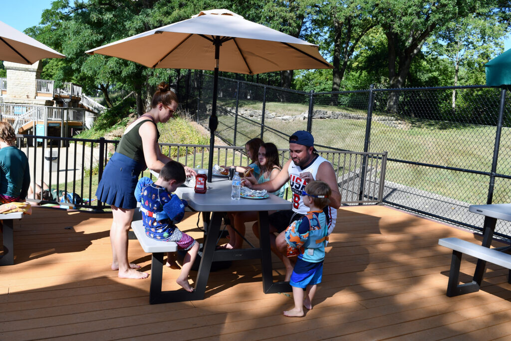 Family having a picnic on an outdoor deck
