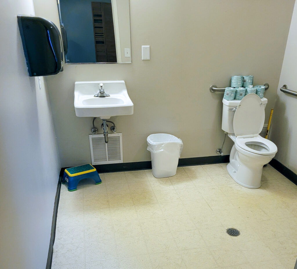 An ADA accessible bathroom with sink and toilet
