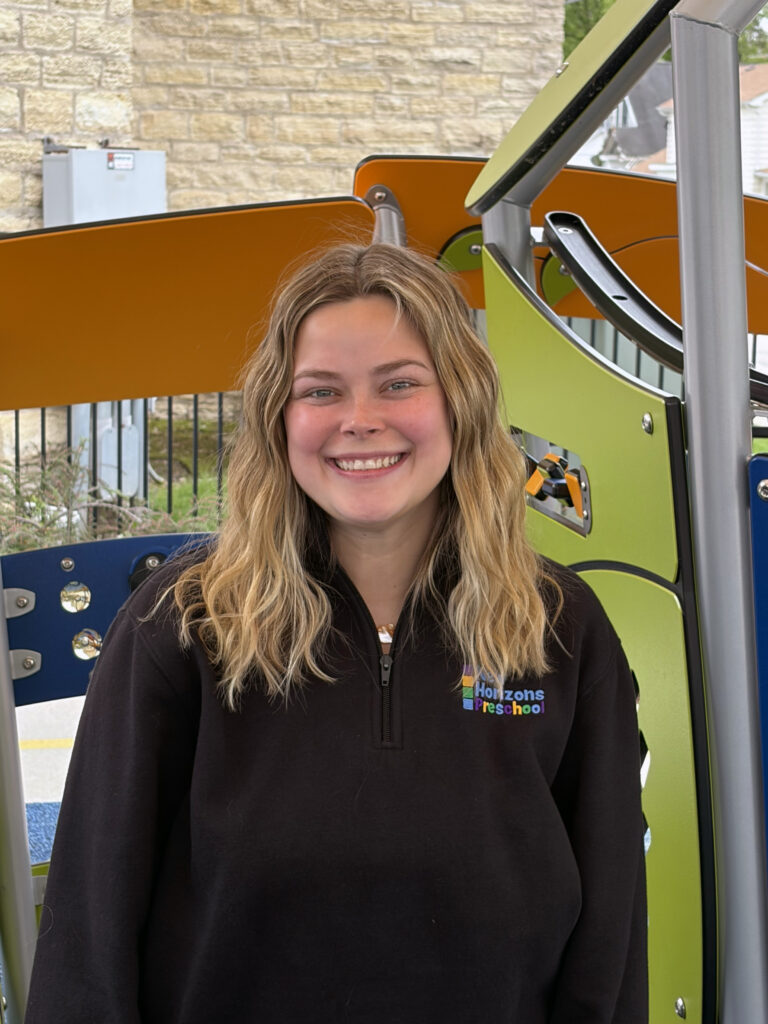 headshot of a preschool teacher outside on the playground
